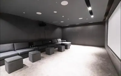 a living room with a couch andools in it at Lux 2 Bedroom Cozy Family Getaway Home in Dubai