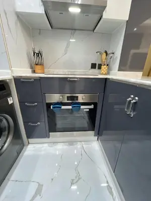 a kitchen with a stove and a dishwasher at Luxurious full renovated apartment in Dubai