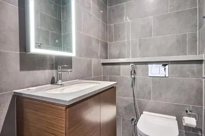 a bathroom with a sink and a toilet at STAY BY LATINEM Luxury 1BR Holiday Home CB 3814 Near Burj Khalifa in Dubai