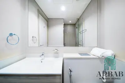 a bathroom with a sink and a large mirror at Arbab Homes Luxury 1BR - Canal View - Damac Zada Tower in Dubai