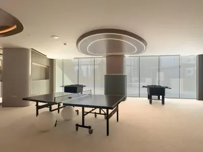a large room with two ping pong tables in it at Modern and Cozy 1 Bedroom with Private Balcony Pool in Dubai