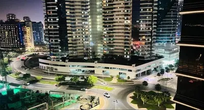 an aerial view of a city at night with buildings at Modren Private Partition Room In Barsha Heights Tecom in Dubai