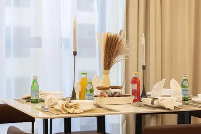 a table with food and other items on it at Luxe 4BR Upscale Beach Side Unit with Pool Table in Dubai