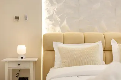 a bedroom with a bed with a lamp on a side table at Lux condo 3 BHK in Dubai Marina in Dubai