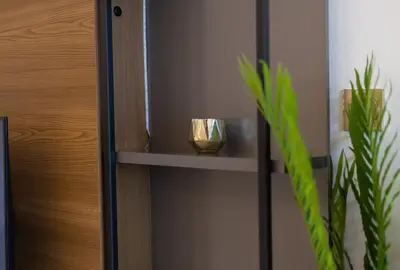 a shelf with two candles and a plant at Lux 3BHK With Pvt Jacuzzi in Marina in Dubai