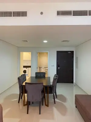 a dining room with a table and chairs at Ghalia in Dubai