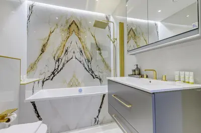 a bathroom with a sink and a shower curtain at Elegant 2-Bedroom Apartment in Marina Heights 1, Dubai Marina in Dubai