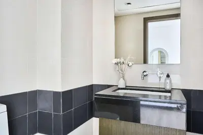 a bathroom with a sink and a mirror at Frank Porter - Loft Tower West in Dubai