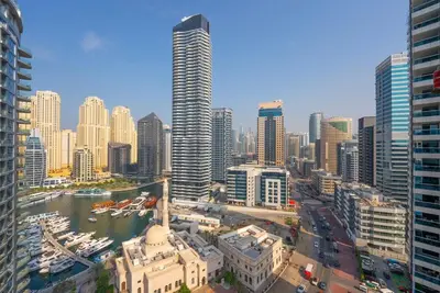an aerial view of a city with tall buildings at Elegant Marina Living Manchester Tower in Dubai