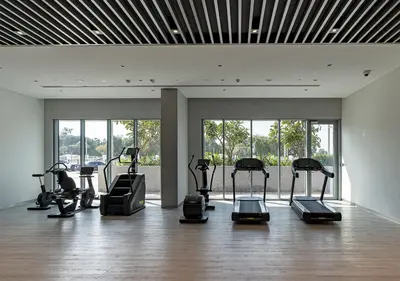 a gym with a bunch of exercise bikes in a room at Canal Front Residence 5, Al Wasl - 2 Bedroom with Maids room - Allsopp & Allsopp 02 in Dubai