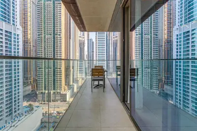 a room with a view of a city with tall buildings at The Residences Marina Gate 1 - 2 Bedroom Apartment - Allsopp & Allsopp in Dubai