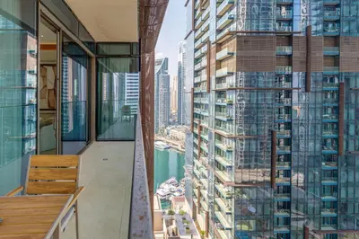 a balcony with a view of a city at The Residences Marina Gate 1 - 2 Bedroom Apartment - Allsopp & Allsopp in Dubai