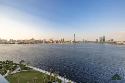 a large body of water with a city in the background at Serene 2BR with Sea View by BMS in Dubai
