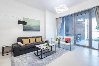 a living room with a couch and a table at Canal Front Residence 5, Al Wasl - 2 Bedroom with Maids room - Allsopp & Allsopp 01 in Dubai