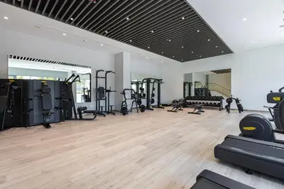 a gym with treadmills and machines in a room at Canal Front Residence 5, Al Wasl - 2 Bedroom with Maids room - Allsopp & Allsopp 01 in Dubai