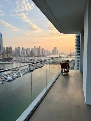 a view of a harbor from the balcony of a building at Ultra Luxury Emaar Beachfront Flat With Private Beach in Dubai