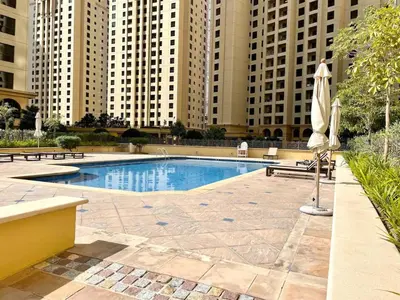 a swimming pool in a city with tall buildings at Specious apartment in Sadaf 7 with Marina Views and Beach Access in Dubai