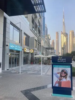 a sign on the side of a city street at Signature Luxury 2Bedroom Burj Khalifa Fountain View in Dubai