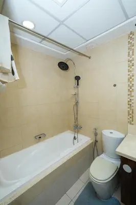 a bathroom with a toilet and a bath tub at Signature Luxury 2Bedroom Burj Khalifa Fountain View in Dubai