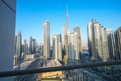 a view of a large city with tall buildings at Signature Luxury 2Bedroom Burj Khalifa Fountain View in Dubai
