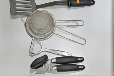 a table with a whisk and other kitchen utensils at Golden Stays - Opulent 2BR View Residence at The Bay in Dubai