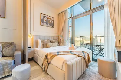 a hotel room with two beds and a balcony at Contemporary Studio Apartment with Balcony & Community Views - Azizi Riviera 48, Al Merkadh by Deluxe Holiday Homes in Dubai