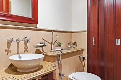 a bathroom with a sink and a toilet at Silkhaus Private Garden in Old Town Zanzebeel Bldg in Dubai
