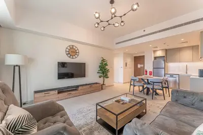 a living room with a couch and a table at HAVN - 1 bedroom in Madinat Jumeirah Living in Dubai