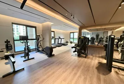 a gym with treadmills and machines in a room at HAVN - 1 bedroom in Madinat Jumeirah Living in Dubai