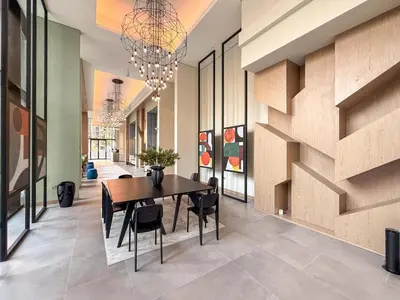 a dining room with a table and chairs at GuestReady - 1BR Luxury | Prime City Area in Dubai
