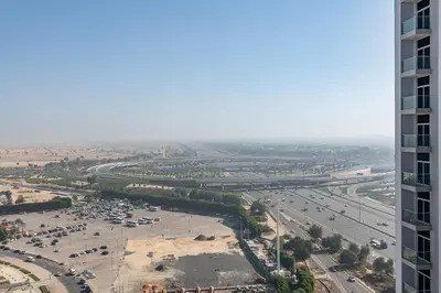 an aerial view of a parking lot from a building at Luxury 1BR - Miracle Garden View - Skyz in Arjan in Dubai