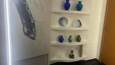 a bunch of vases sitting on shelves in a room at Full marina view private pool vip adult only no halal in Dubai