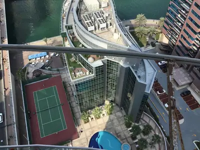 an overhead view of a building with a tennis court at Full marina view private pool vip adult only no halal in Dubai