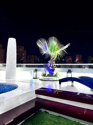 a pool with a palm tree on top of a building at Full marina view private pool vip adult only no halal in Dubai