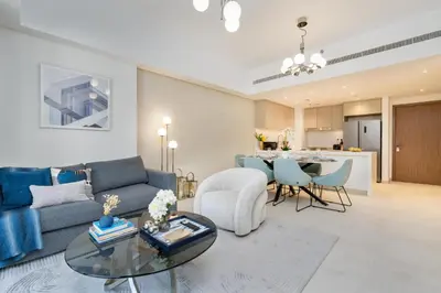 a living room with a couch and a table at Brand New Luxury Family Friendly 3 beds Near Burj AlArab Ultimate Stay in Dubai