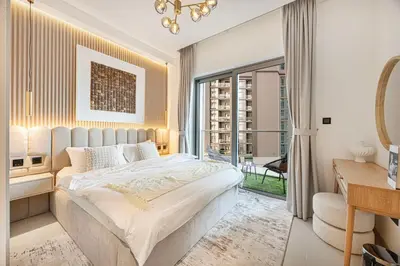 a bedroom with a large bed and a large window at Burj Khalifa & Downtown Skyline View Apartment in Dubai