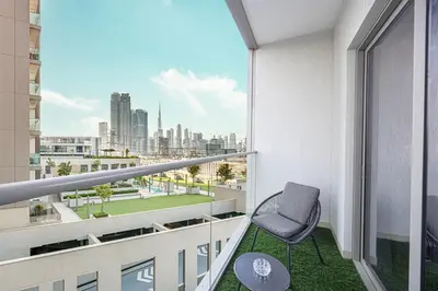 a balcony with a chair and a view of a city at Burj Khalifa & Downtown Skyline View Apartment in Dubai