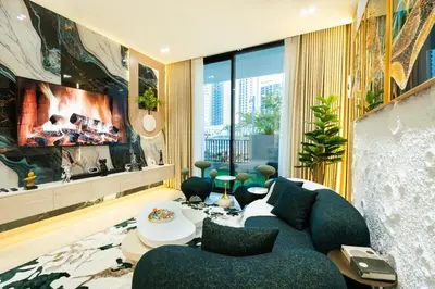 a living room with a blue couch and a large window at Binghatti Aurora, JVC Dubai - Unique Round Bed Experience with pool view in Dubai