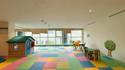 a room with a toy house and a colorful floor at Luxury Duplex Penthouse with Stunning Marina Views in Dubai