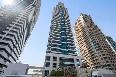 two tall buildings standing next to each other at Spacious and Cozy 1BR Opal Tower Stunning Marina View in Dubai