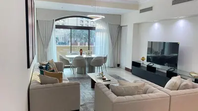 a living room with two couches and a dining room at Luxury 1-Bedroom, Golden Mile Palm Jumeirah in Dubai