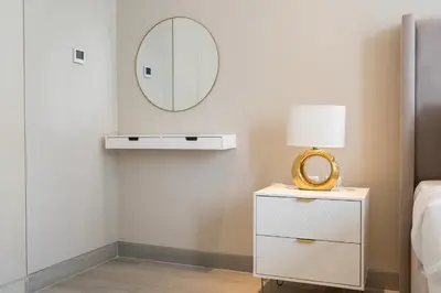 a bedroom with a mirror and a white dresser at Luxury Studio at Marina Star - Near JBR - Marina in Dubai