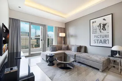 a living room with a couch and a table at 2 bedroom in heart of Business Bay - Dubai in Dubai