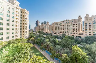 an aerial view of a city with tall buildings at Exclusive Waterfront Residence with Private Beach Access, Near Palm Jumeirah Mall and Restaurants - Jash Hamad Shoreline B18, Palm Jumeirah by Deluxe Holiday Homes in Dubai