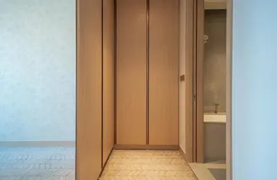 a bathroom with wooden cabinets and a sink at 2BR Vida Dubai Mall Burj Khalifa & Fountain View in Dubai