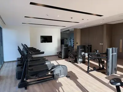 a gym with several treadmills and cardio machines at BRAND NEW 2 BDR apartment with beach access in Dubai