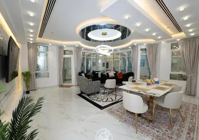 a living room with a table and a couch at Luxury 3 Bed flat in Marina crown in Dubai