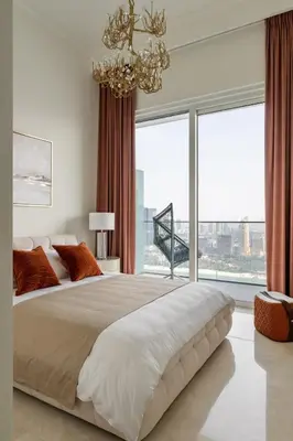a bedroom with a large bed with a large window at Ultimate Beachfront family home with panoram views! in Dubai