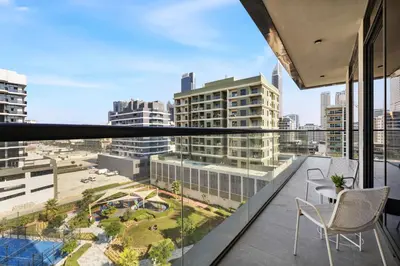 a balcony with chairs and a view of the city at Stylish 1BR Retreat Near World Trade Center Metro in Dubai