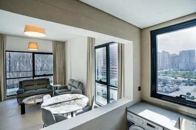 a living room with a view of a city at Speedway Vacation Homes Rental LLC in Dubai